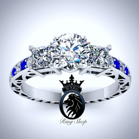 Princess Accented Round Cut Diamond and Sapphire Engagement Ring